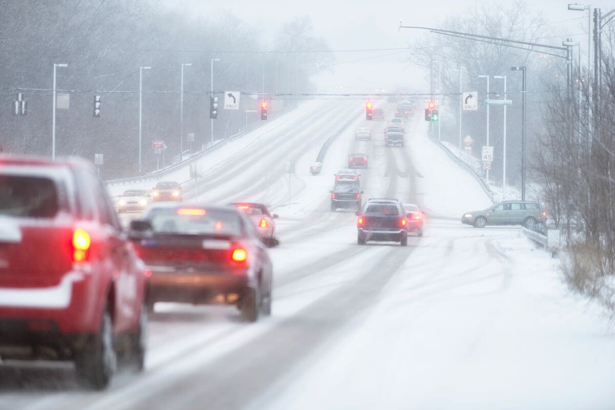 Cars navigate Montana's snow-covered roads