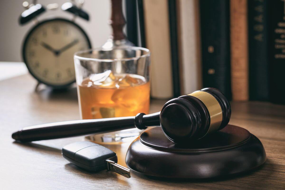 Alarm Clock with a Glass of Beer and Gavel