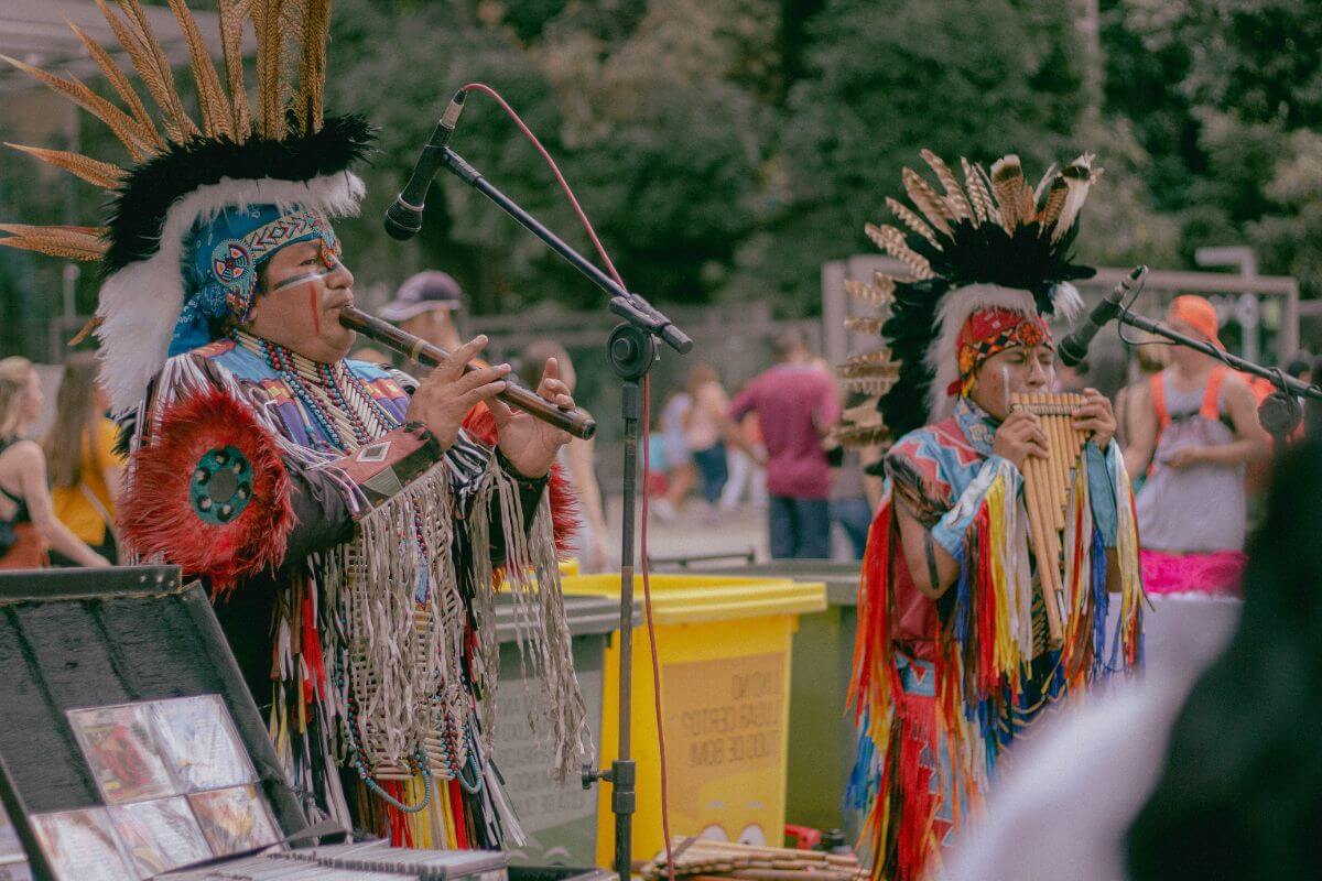 American Indians Playing Music in a Large Crowd