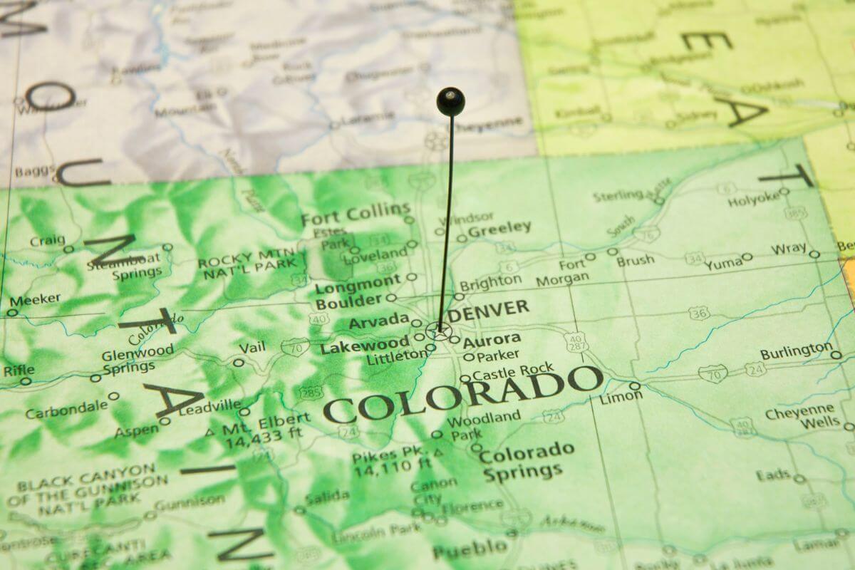 A pin is pinned on a map of Colorado.