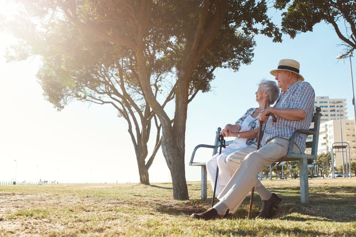 An Elderly Couple Sitting on a Park Bench in Montana