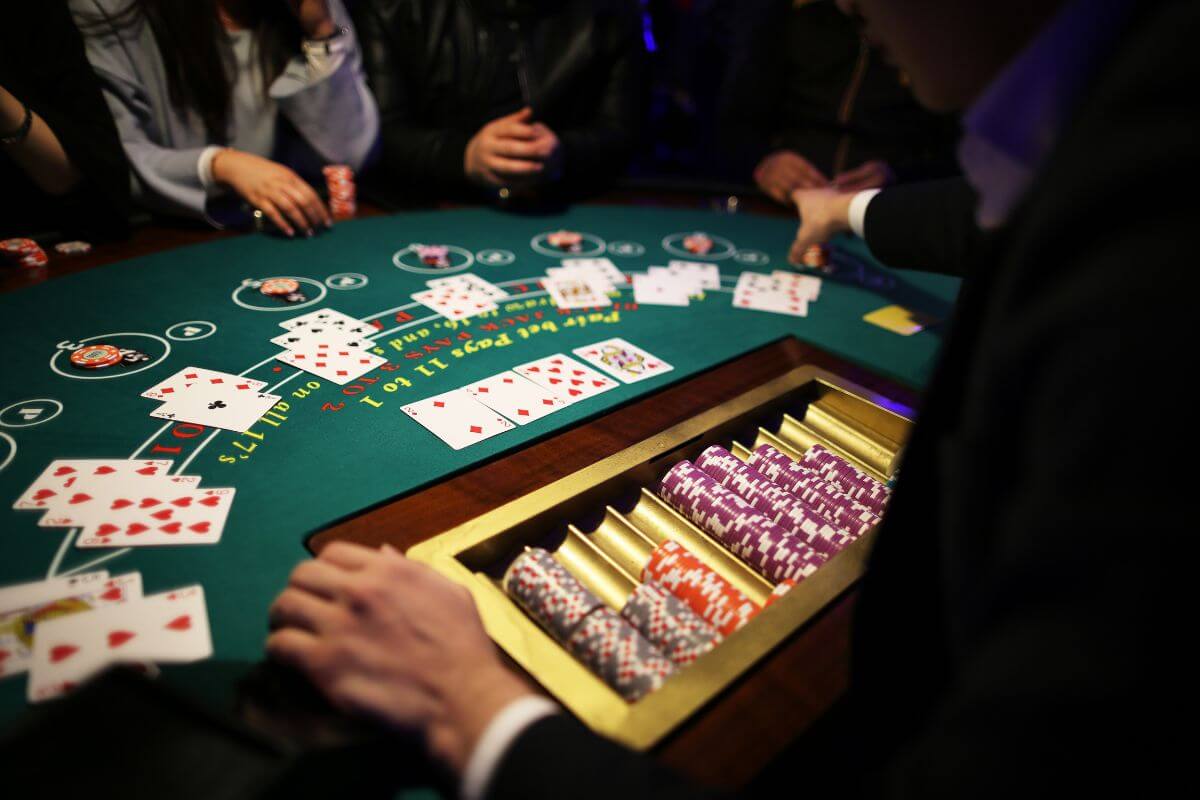 A group of people playing blackjack at a casino hotel in Montana.