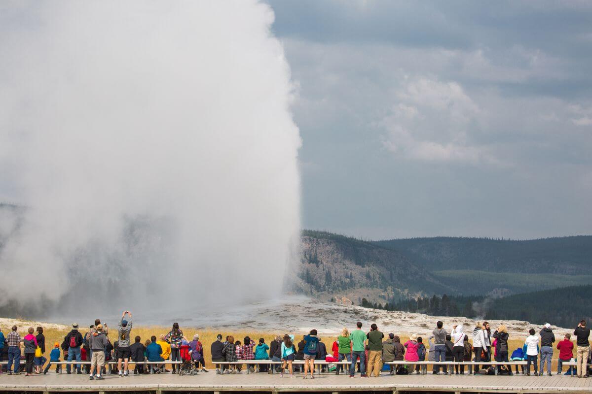 A group of adventure seekers gathered to marvel at the magnificent geyser in Montana.