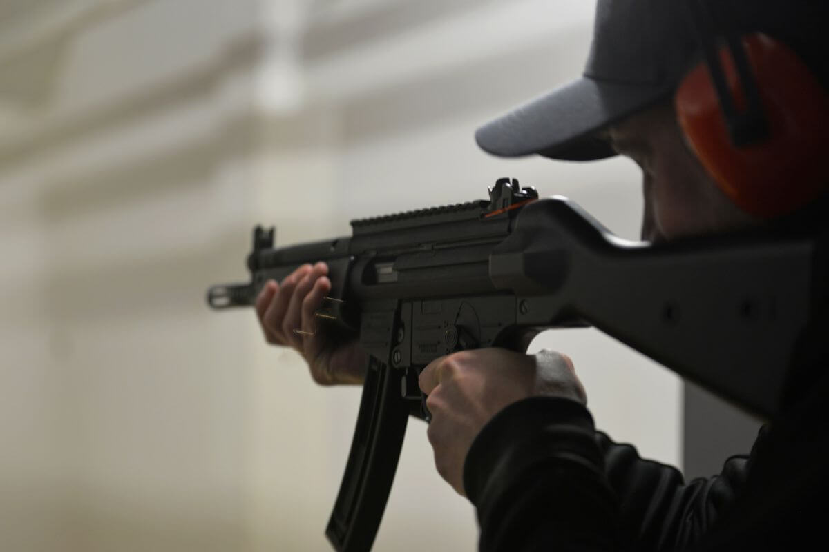 A man holding a rifle.