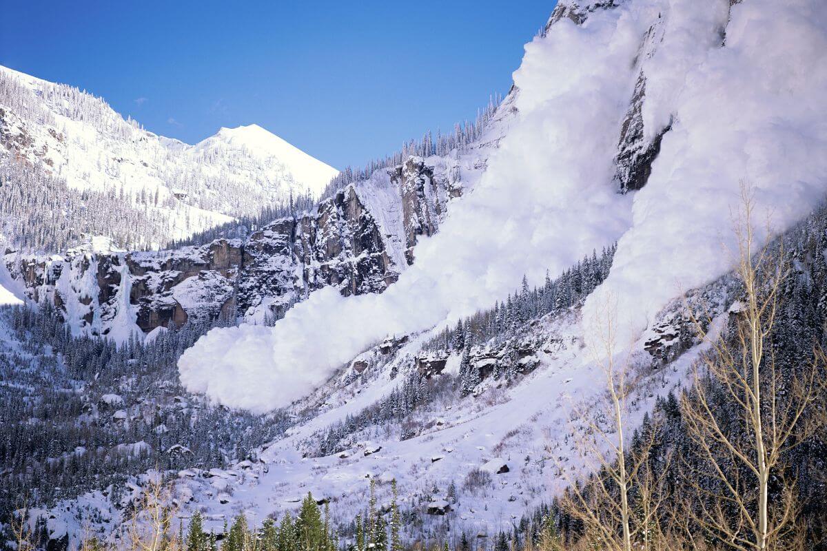 An avalanche on a mountainside during winter in Montana.