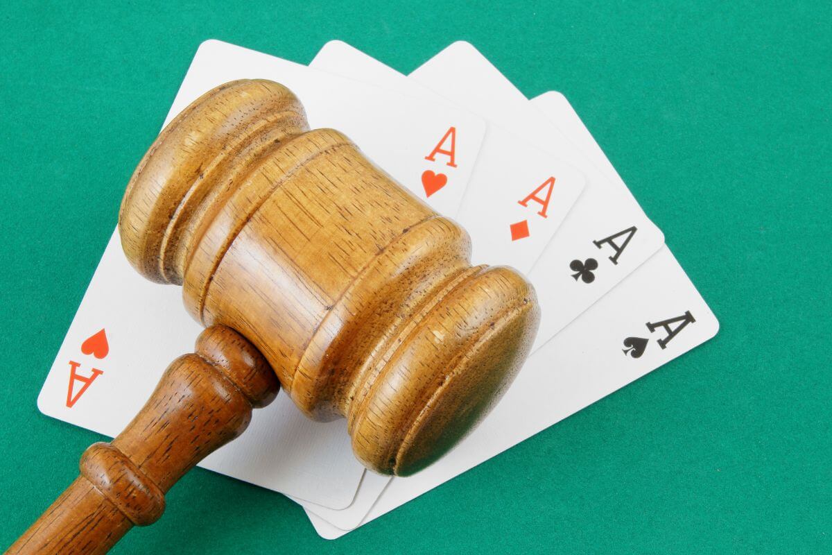 Gavel on Top of Four Playing Cards of Aces