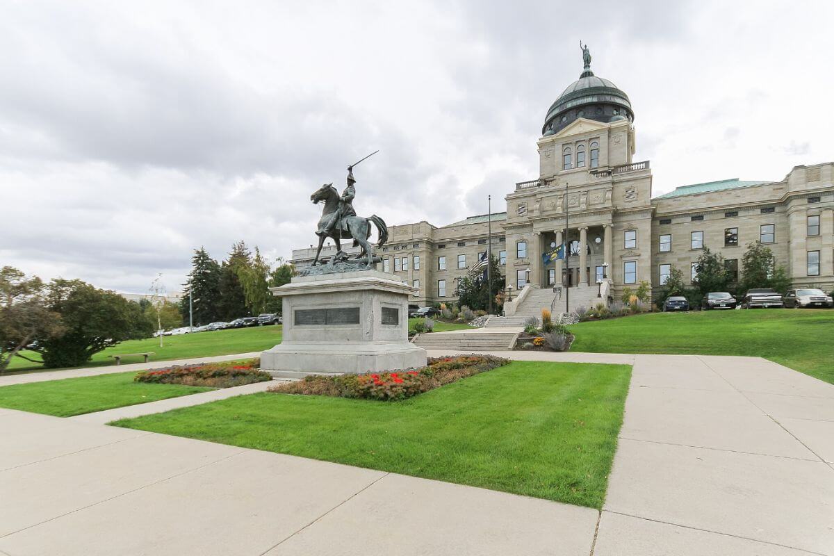 The Montana State Capitol with its iconic statue as seen in Helena, Montana.