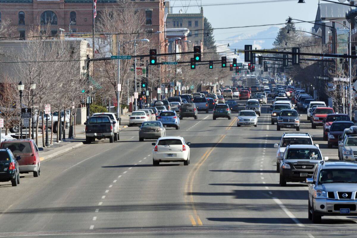 A bustling city street with cars driving in Montana.
