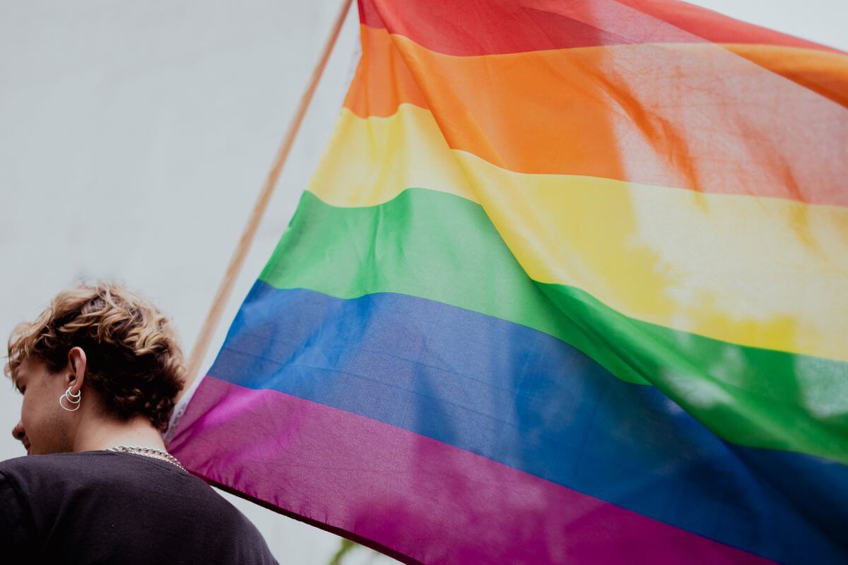 A woman with a rainbow flag