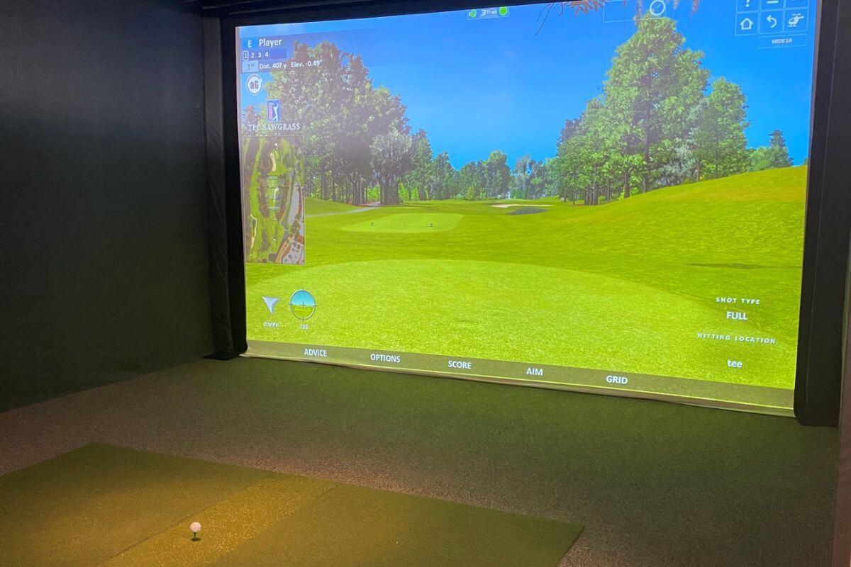 The Golf Room mini golf course in Great Falls featuring a large flat screen TV.