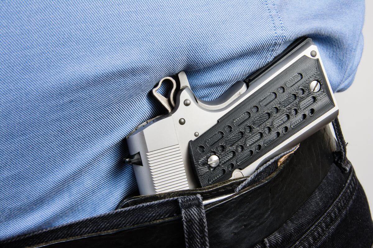 Gun Tucked in the Waist of a Man's Pants