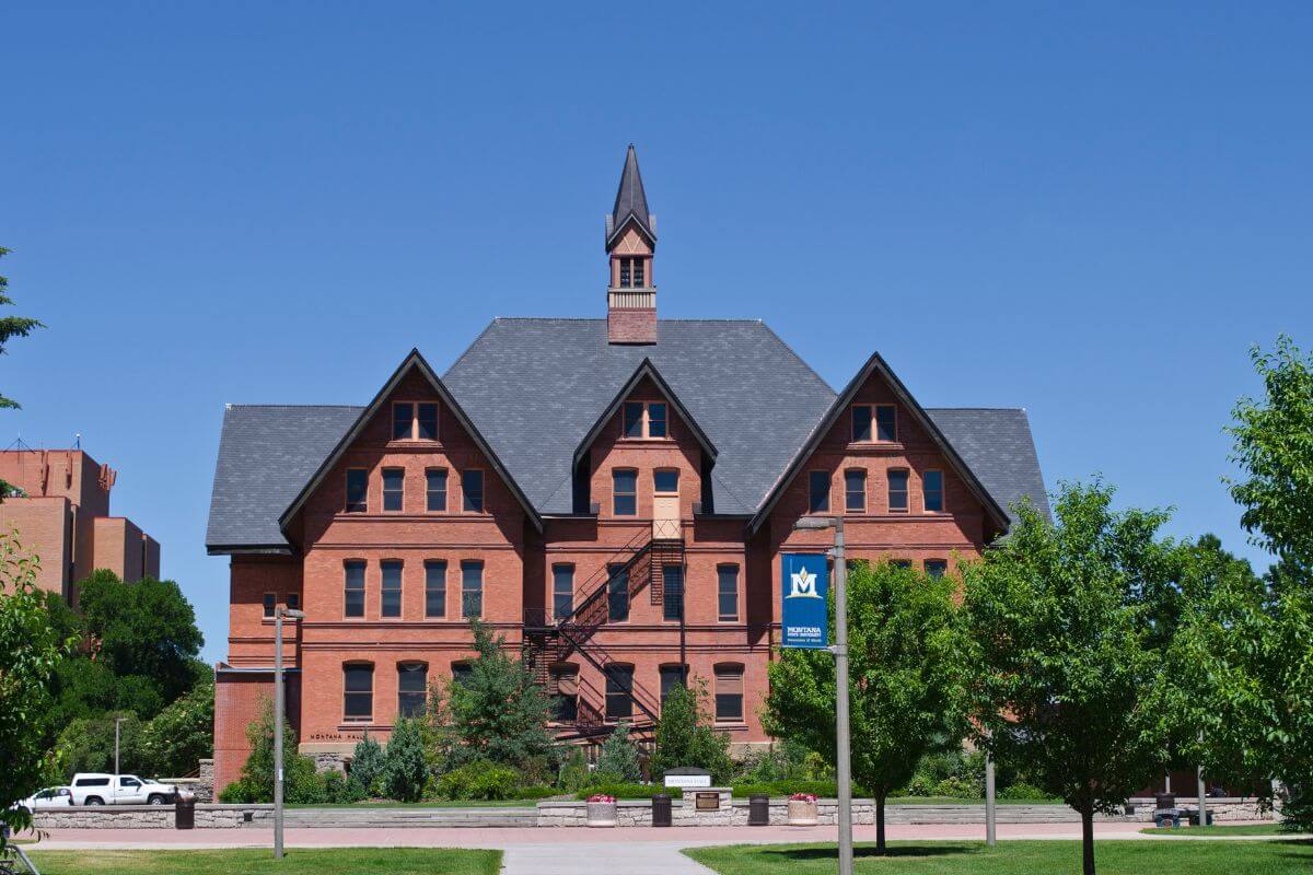 A large brick building with a clock tower in Montana