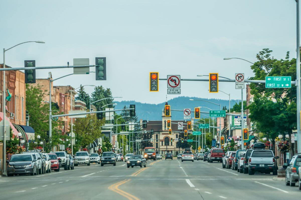 A street with cars driving down in Kalispell, Montana