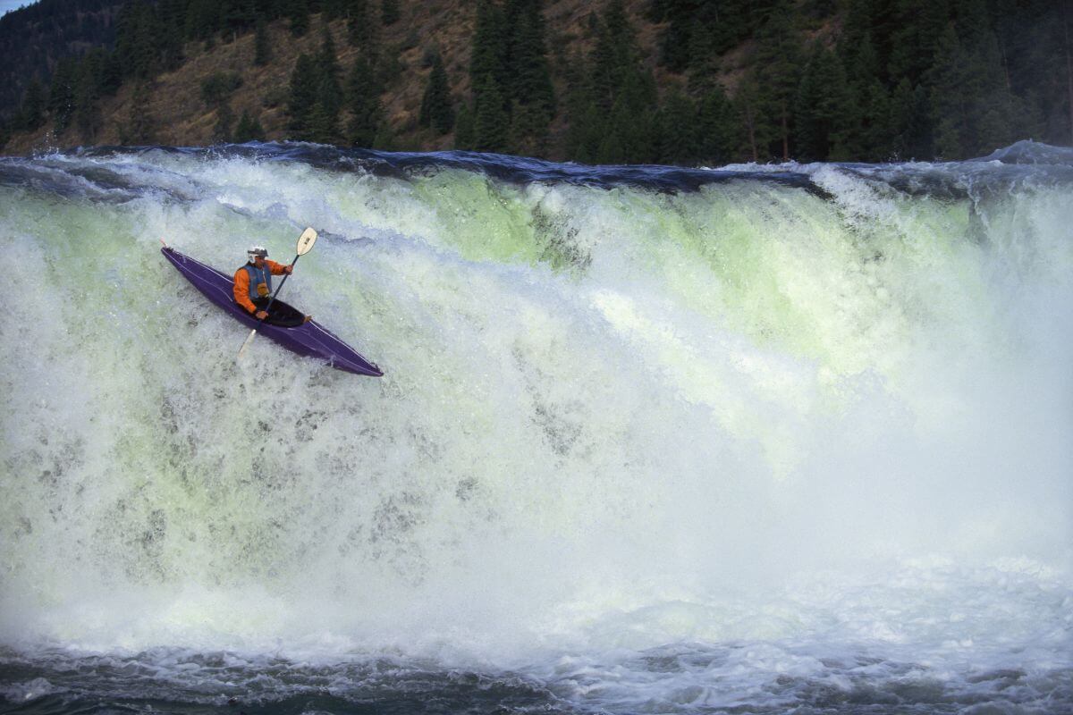 A man kayaking on the Kootenai River, Montana.