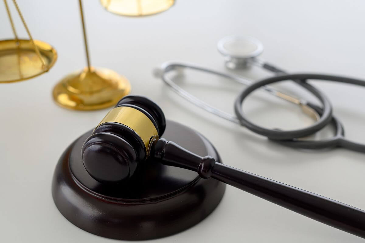 Justice Scale with Gavel and Stethoscope