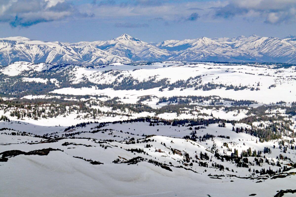 A snow-covered slope with mountains in the background in Montana