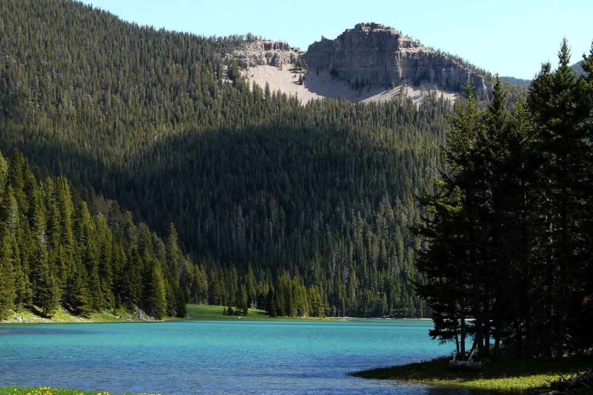 Blue-green waters of Crystal Lake in Montana nestled in the mountains.