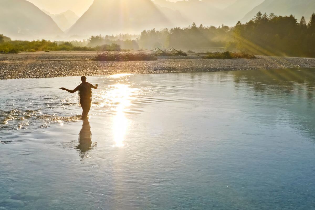 A man fishing in the river at the Ranch at Rock Creek, Montana.