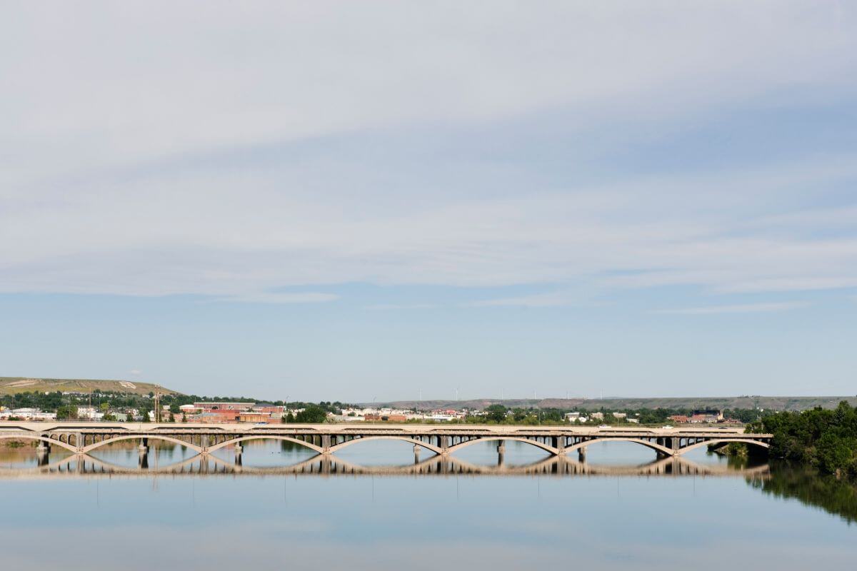 A bridge reflects in water