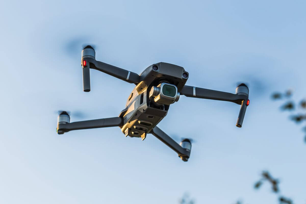 A camera-equipped drone hovers in the air, one of the aircraft prohibited by Montana hunting regulations.