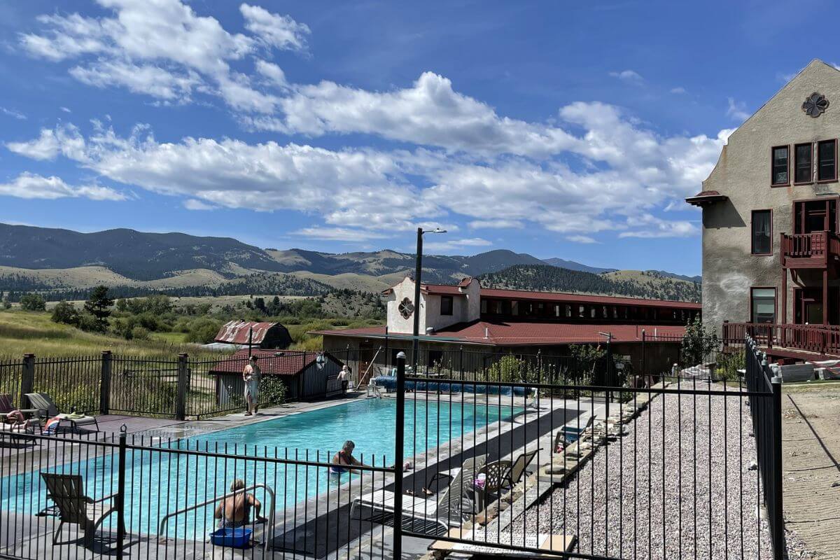 Boulder Hot Springs in Helena under a blue sky with mountains in the background