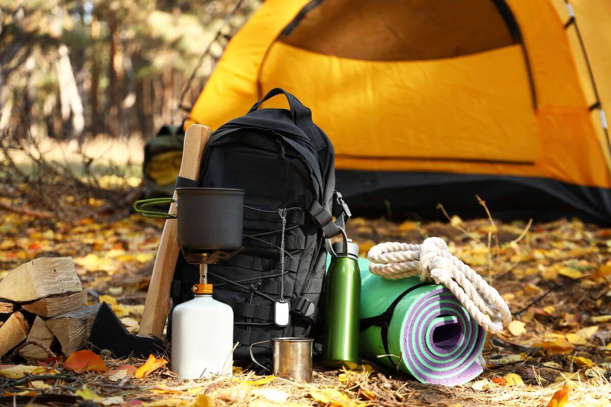 A pitched tent and camping gear are set up at the Emerald Lake campground.