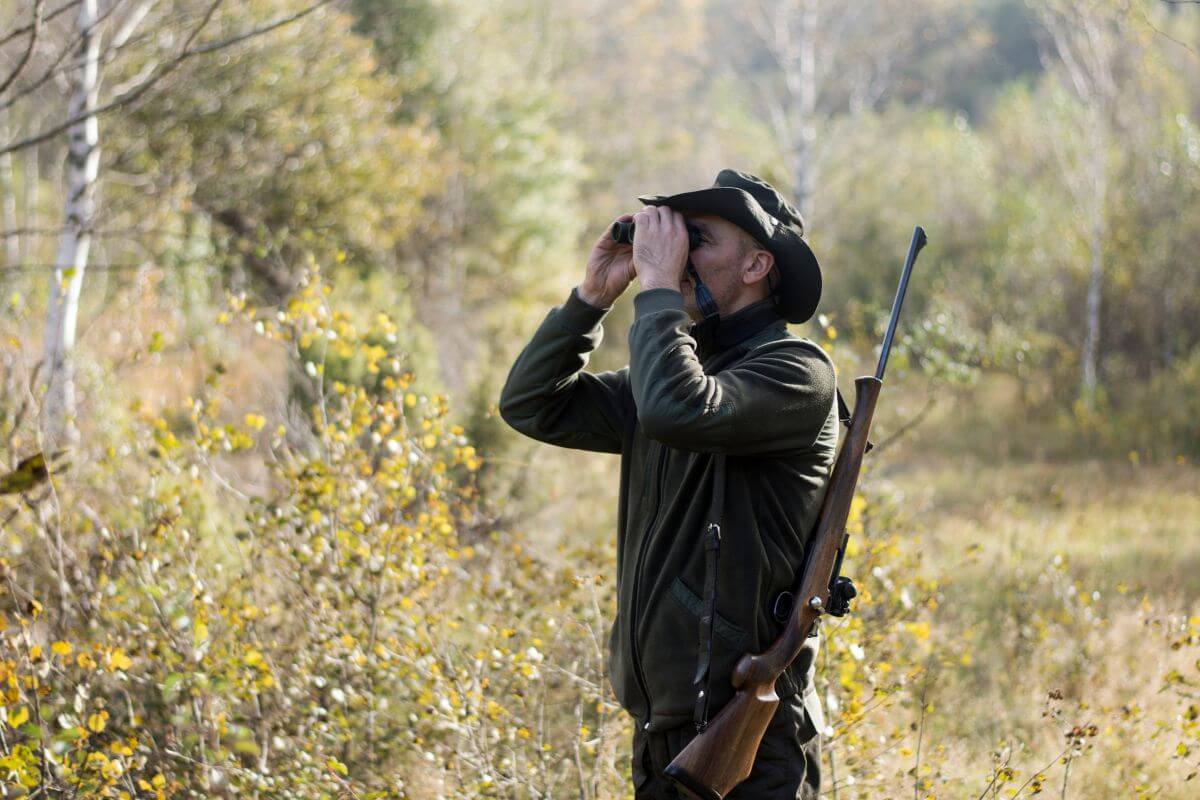 A man on a DIY Montana antelope hunting trip scans the area for antelope prey.