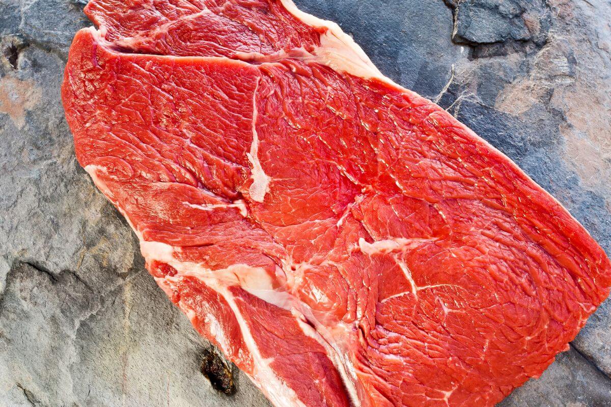 A piece of steak is sitting on a rock in Montana.