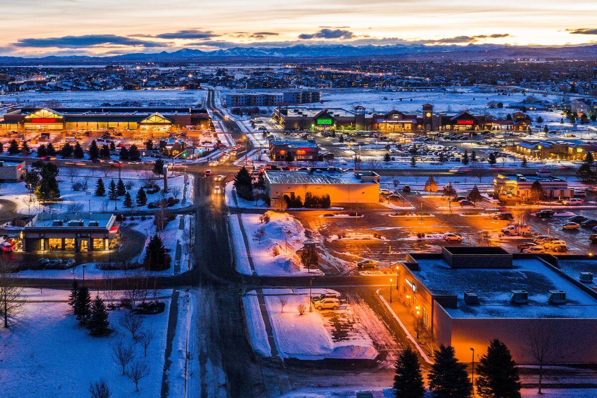 An aerial view of a snow covered town at dusk in Montana.
