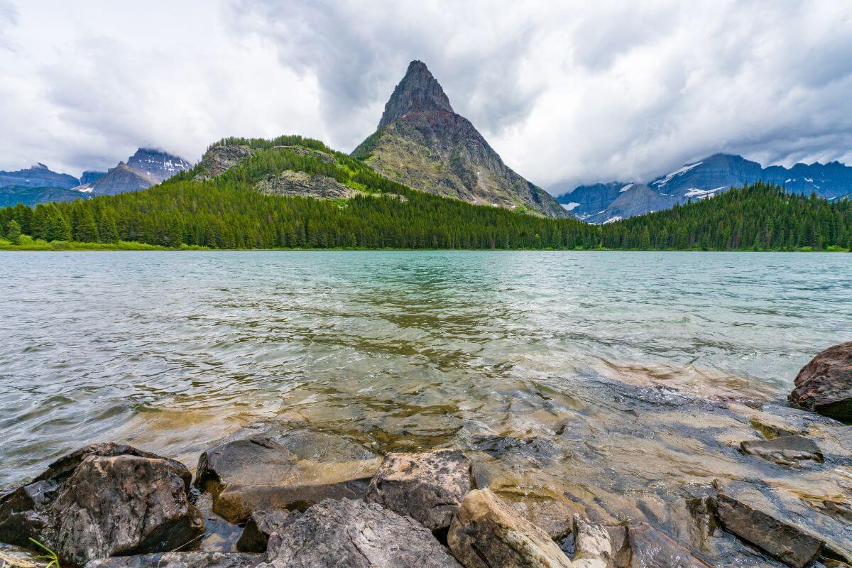 Swiftcurrent Lake, located near Hidden Falls, against a stunning mountain background 