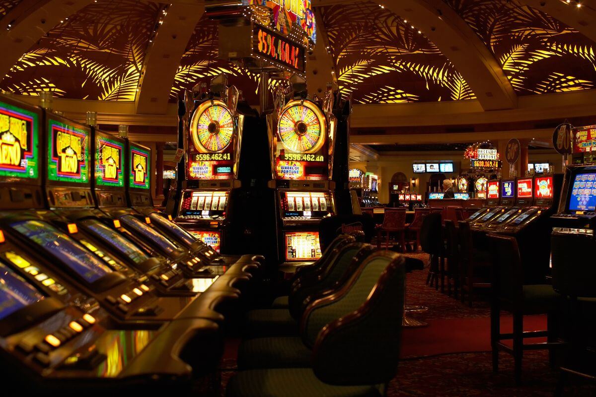 A area in one of the top Montana casino hotels lined with slot machines.