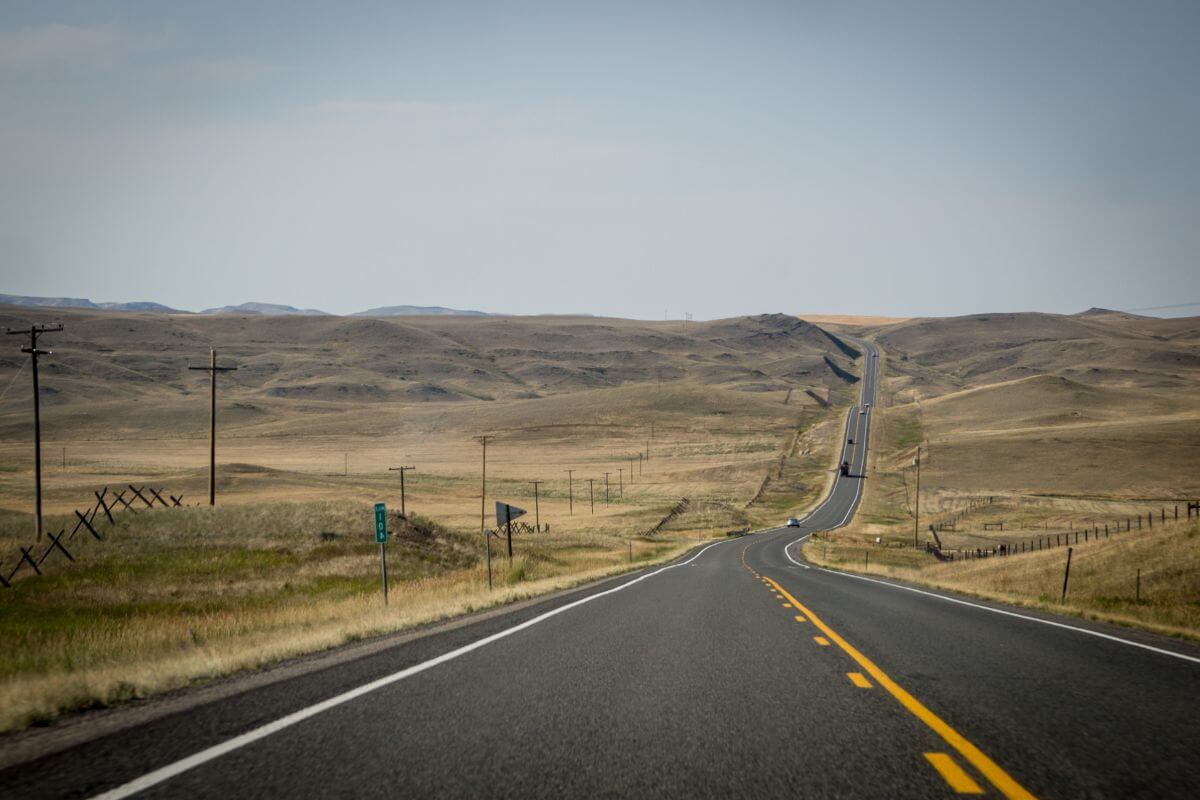 A nearly empty road through the Montana plains