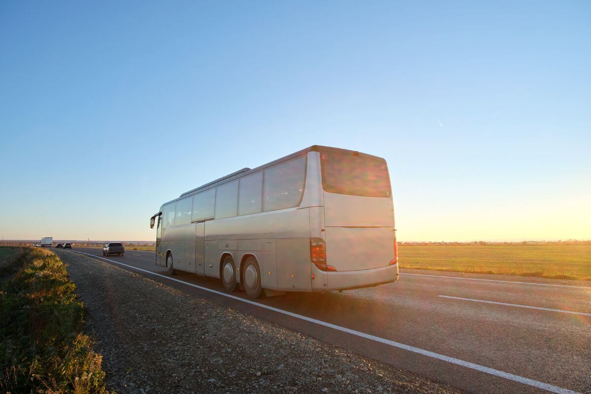 A tourist bus from Total Transportation glides along the open highway during one of their Montana bus tours.