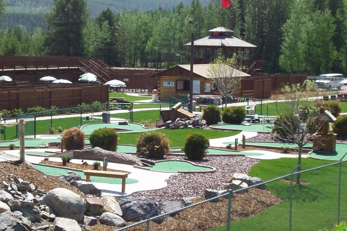 The Amazing Fun Center's mini golf course in Coram, Montana, is corralled and decorated with shrubs and stone paths