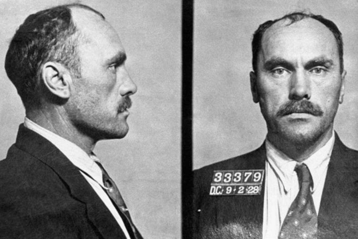 A mugshot of a man with a mustache taken in Montana.
