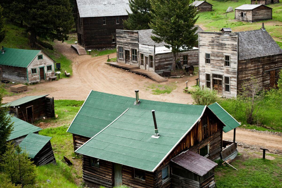 An aerial view of wooden houses with green roofs in Garnet Ghost Town in Montana.