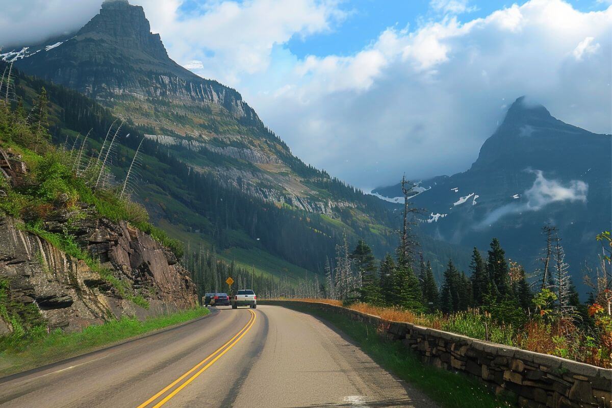 A car driving down Going-to-the-Sun Road in Glacier National Park.
