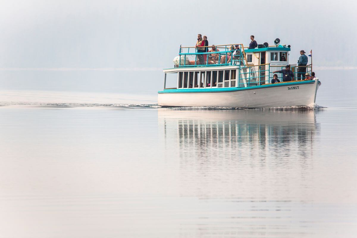 Passengers enjoy a ride aboard the DeSmet, a boat from Glacier Park Boat Company prepared for Lake McDonald Boat Tours.