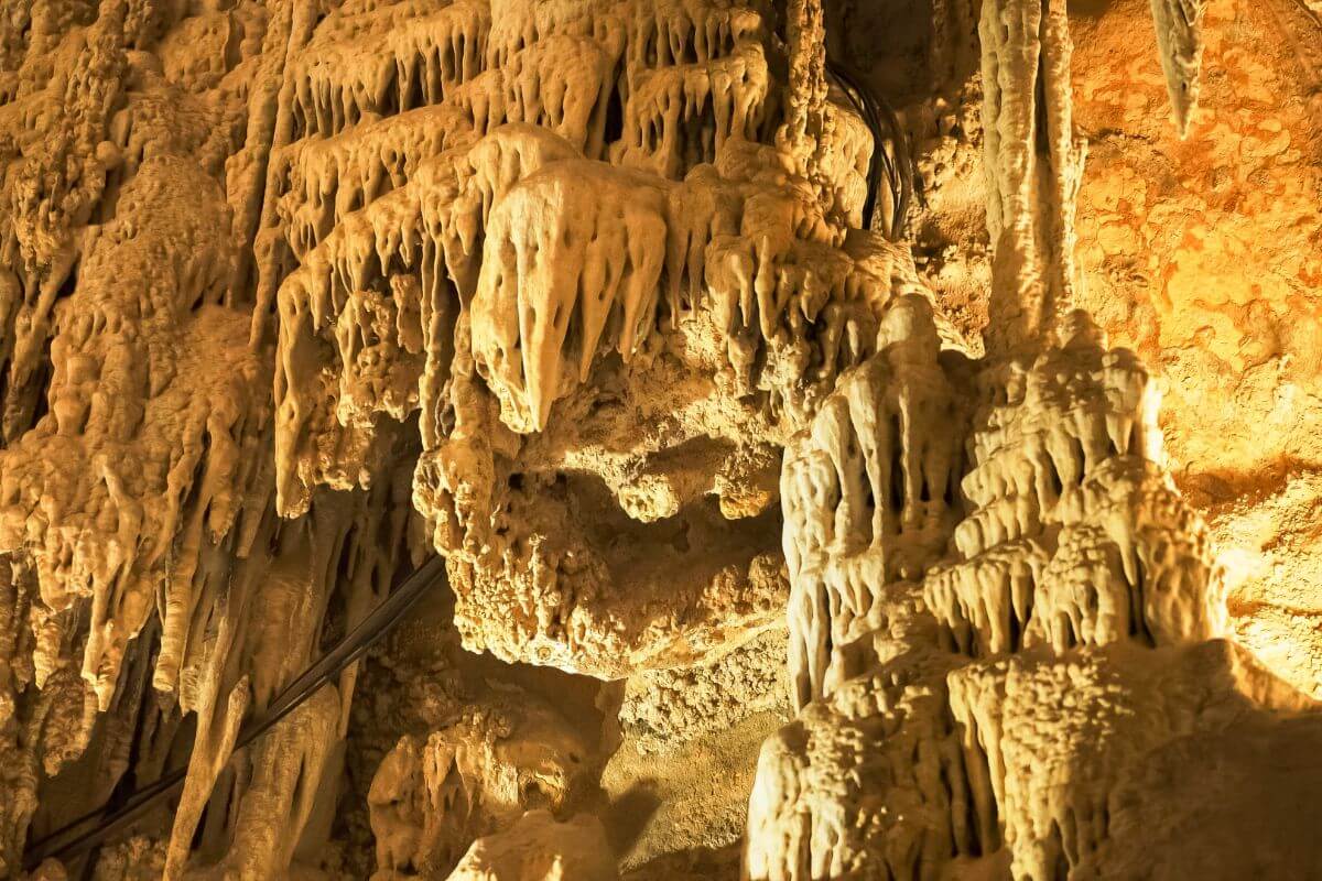 A cave with many stalactites and stalagmites, nestled in Montana.