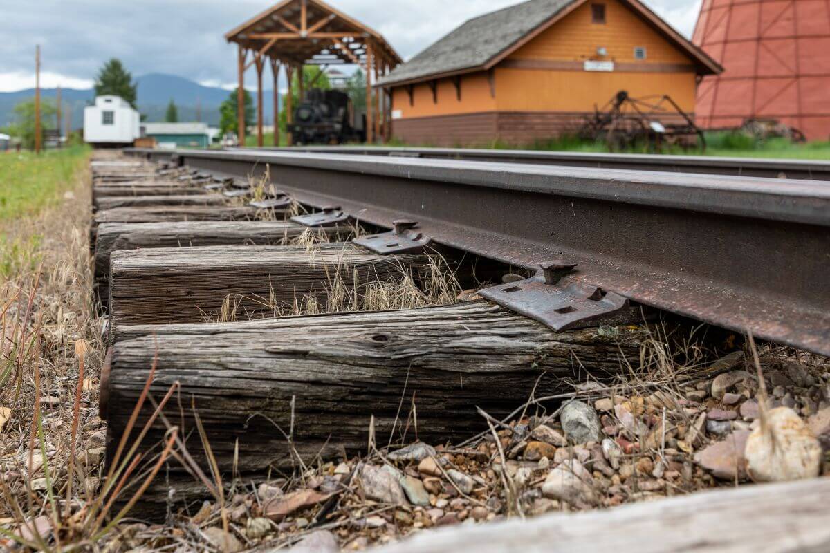A train track in front of a house in Montana.