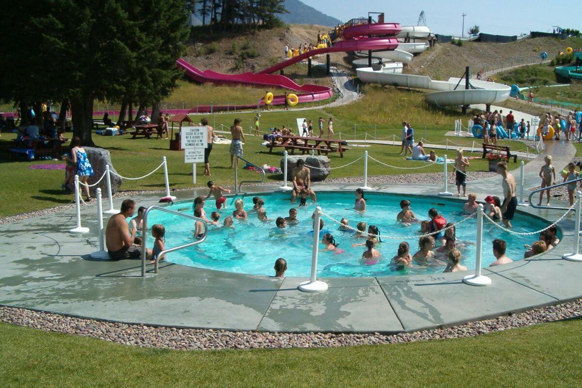Adults and kids enjoying the smaller pool at Ridge Waters Waterpark.