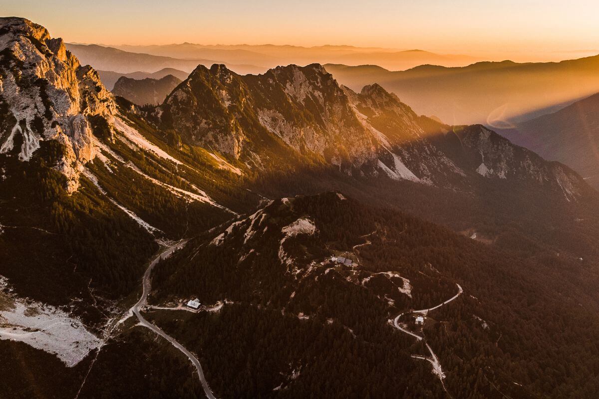 An aerial view of a mountain range at sunset in Montana.