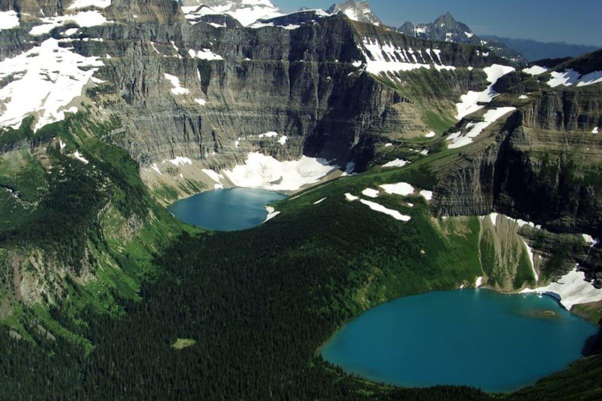 An aerial view of Lake Nooney and Wurdeman amid the rugged mountain peaks of Glacier National Park