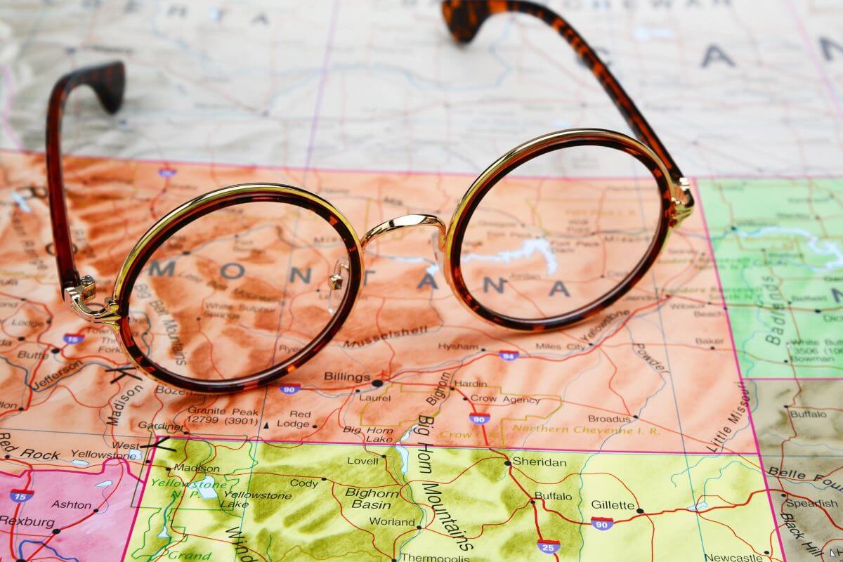 A pair of glasses on top the map of Montana.