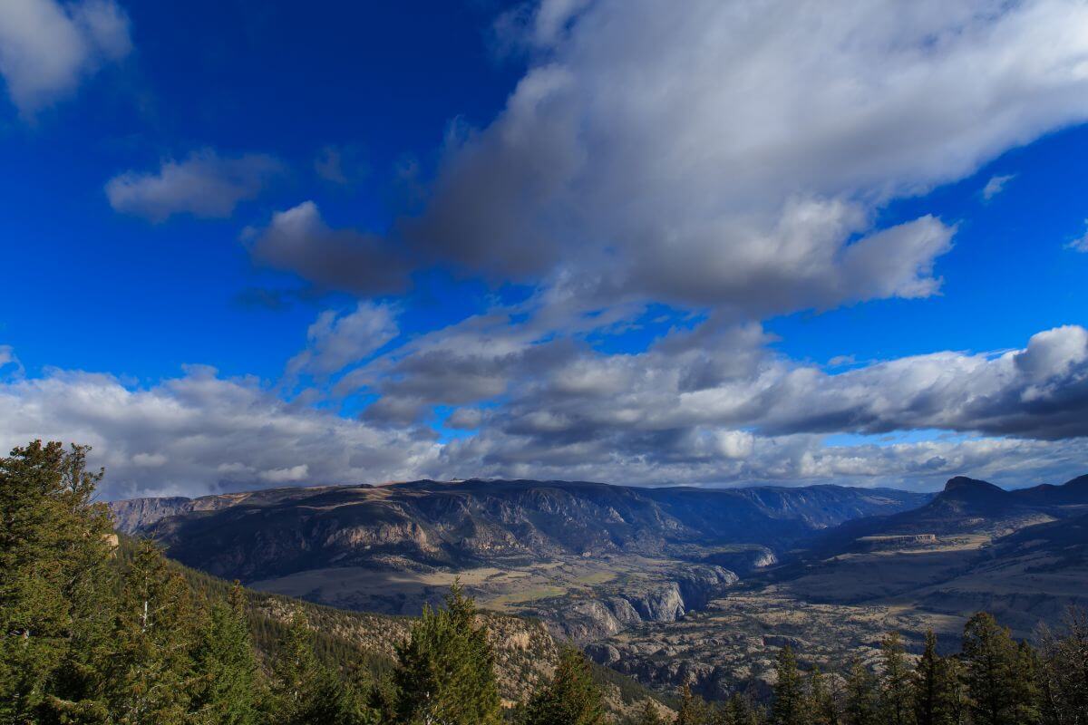 A view of a valley in Montana with clouds in the sky.