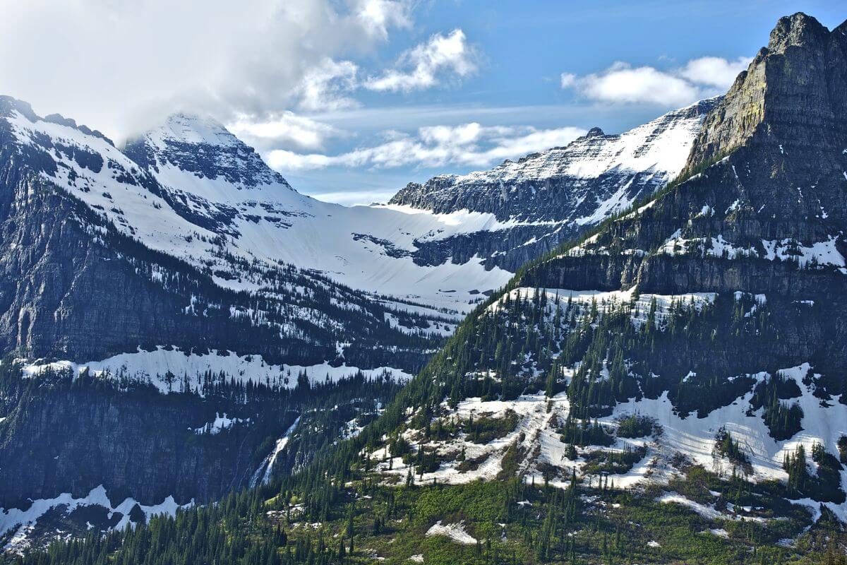 Snow-covered mountain peaks with patches of greenery in Snowy Mountains, one of the best Montana elk hunting districts.