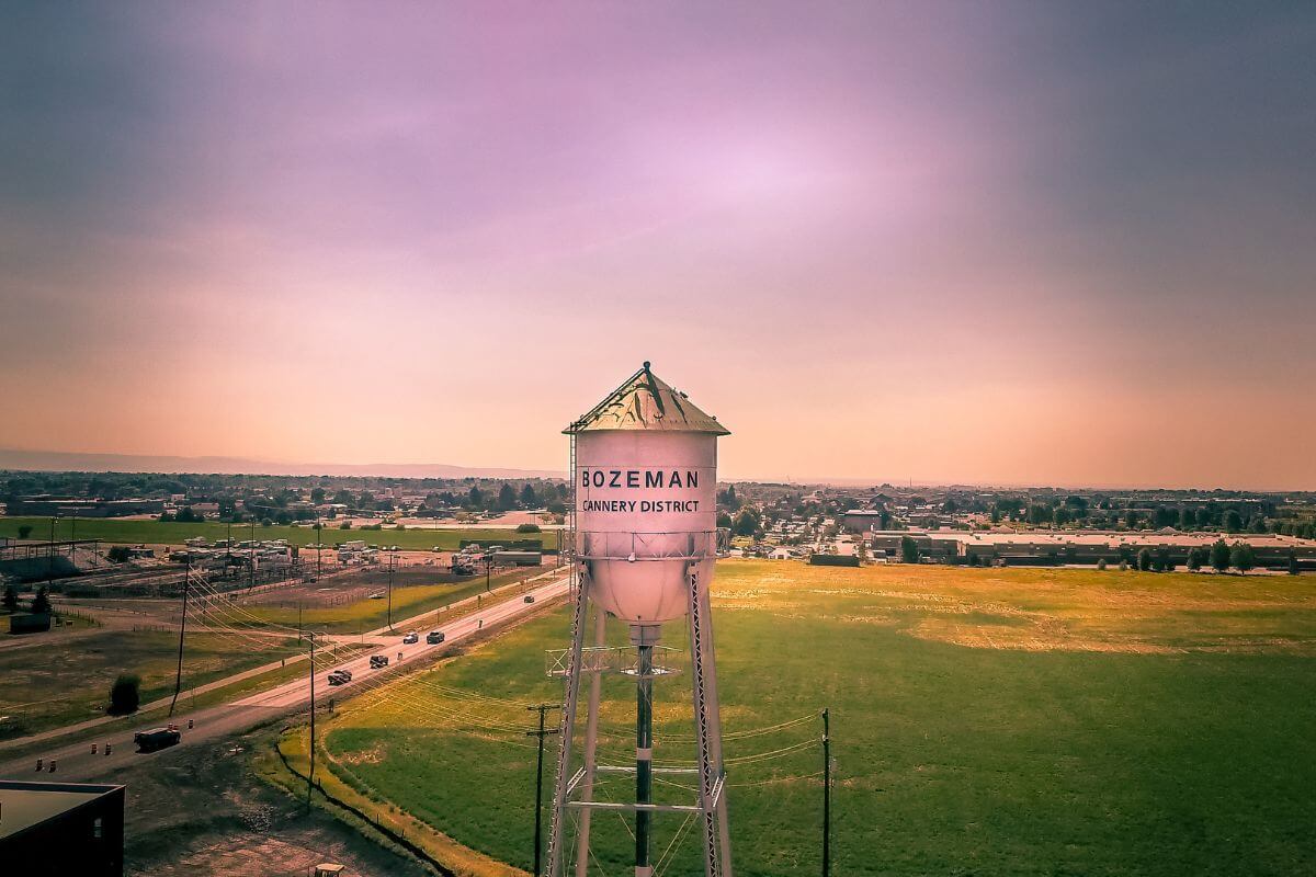 A water tower in a field surrounded by some of the most expensive homes in Montana.
