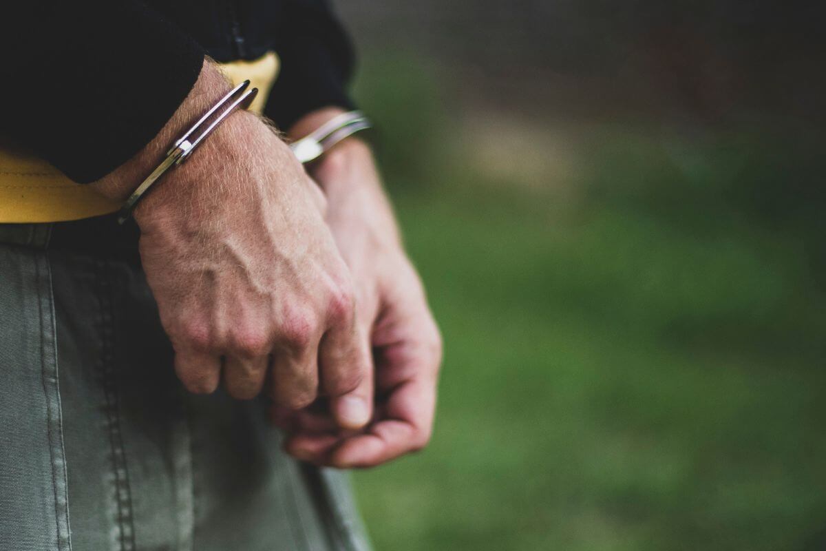 Hands of a Man with Handcuffs