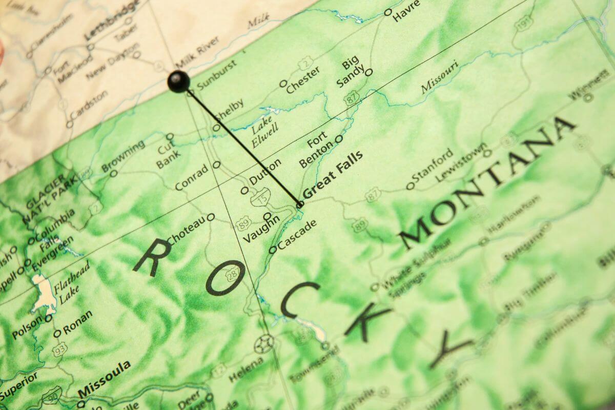 A pin is pinned on a map of Montana.