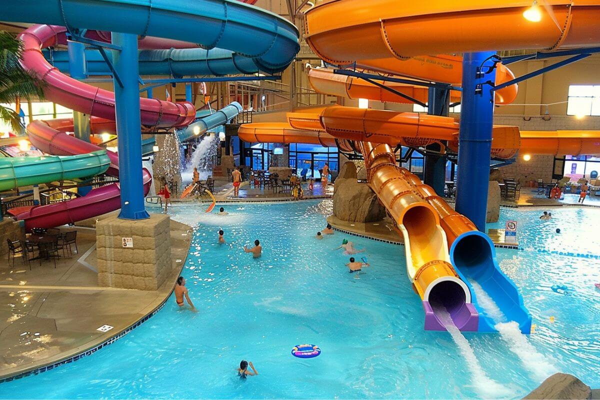 A colossal indoor water park bursting with an abundance of thrilling water slides as seen in Reef Indoor Waterpark.